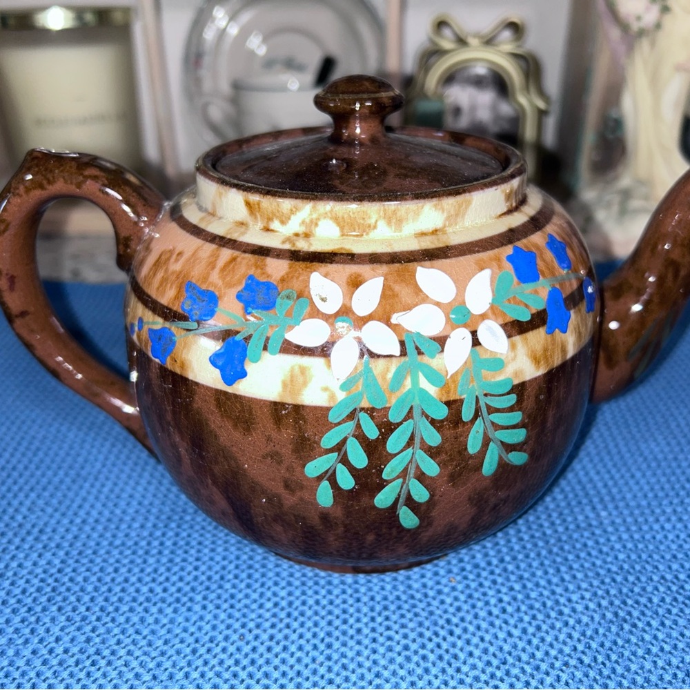 Hand-Painted Brown Ceramic Teapot with Blue Floral Motif